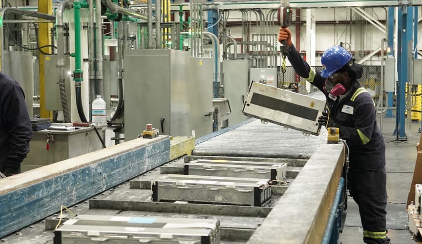 A worker handles spent batteries at Ascend Elements’ Covington, Georgia battery recycling facility.