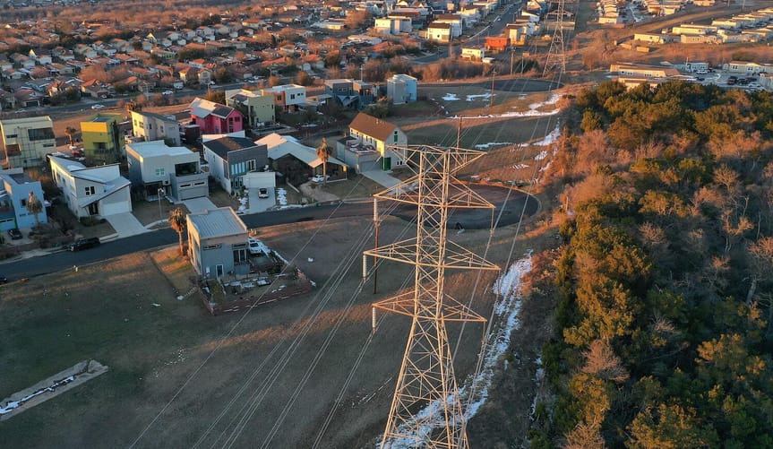 Aerial shot of a neighborhood and electrical lines