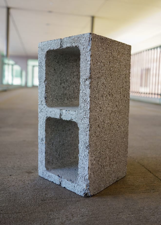 A gray concrete block standing upright