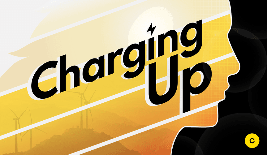 A human figure is shown in silhouette along with wind turbines and the words Charging Up