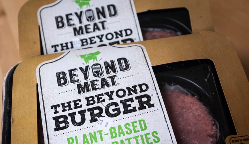 Two packages of meat-like patties with label beyond meat the beyond burger