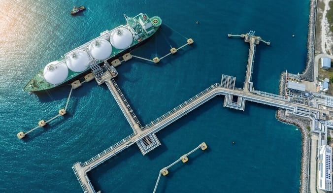 An aerial photograph of an LNG terminal and its sprawling infrastructure