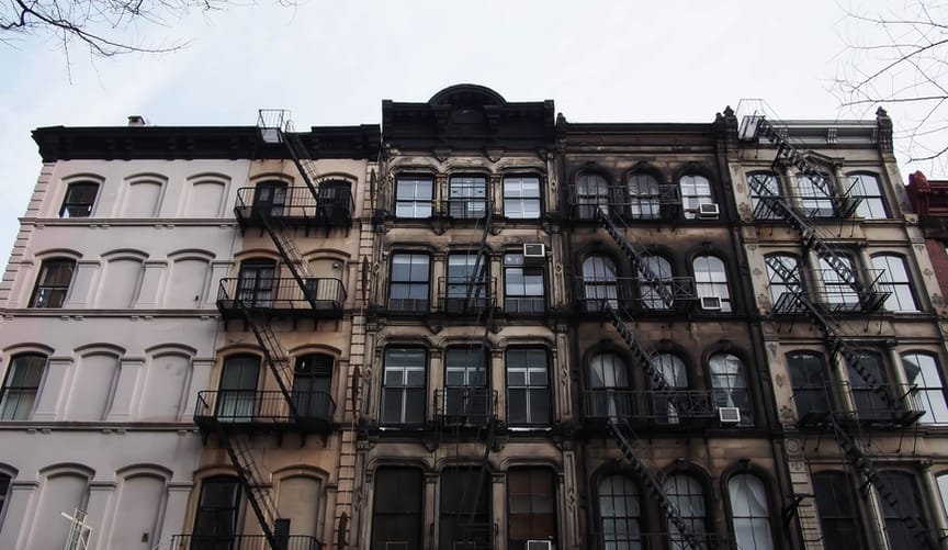 a tall apartment building on a city street