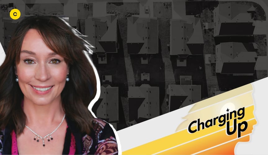 A smiling woman with a light skin tone and shoulder-length brown hair next to a stylized graphic that reads "Charging Up"