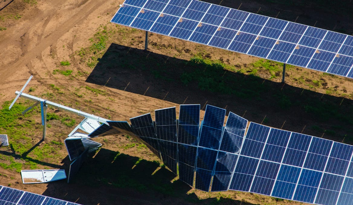 a row of solar panels that were damaged by a storm