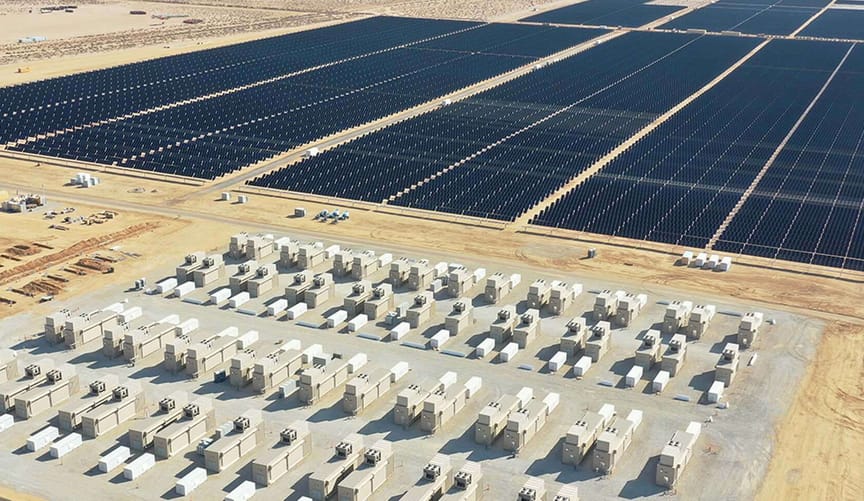 vast desert area partially covered by solar panel and batteries