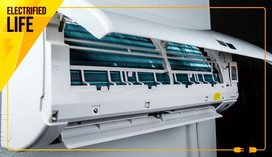 A long white appliance mounted on a wall with its cover popped open, revealing bluish material inside.