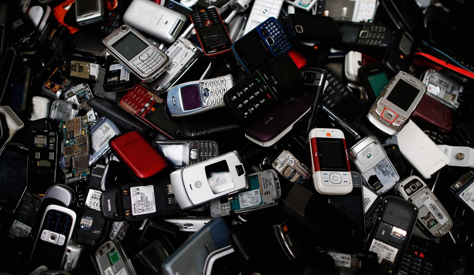 A pile of discarded electrical and electronic components.