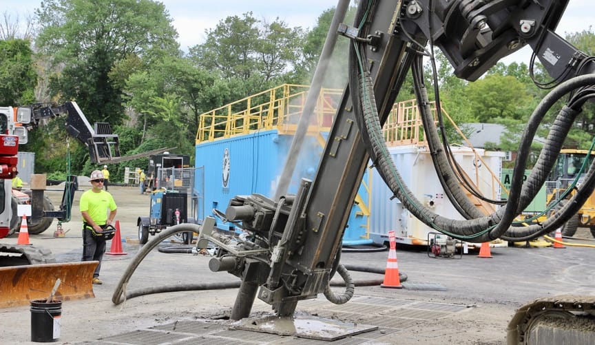 A drilling crew boring a geothermal well for utility Eversource's thermal energy network project in Framingham, Massachusetts