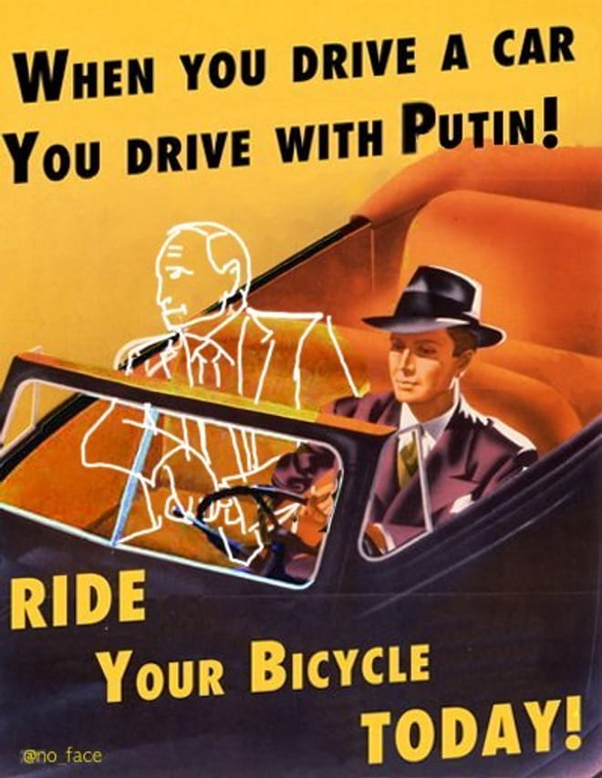 Poster showing text "When you drive a car, you drive with Putin! Ride your bicycle today!"
