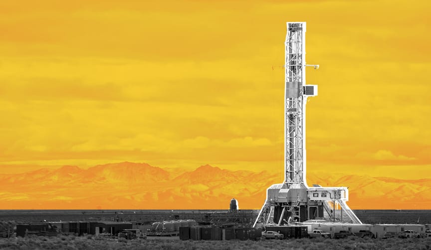 A tall narrow industrial structure set against a yellow-gold graphic backdrop