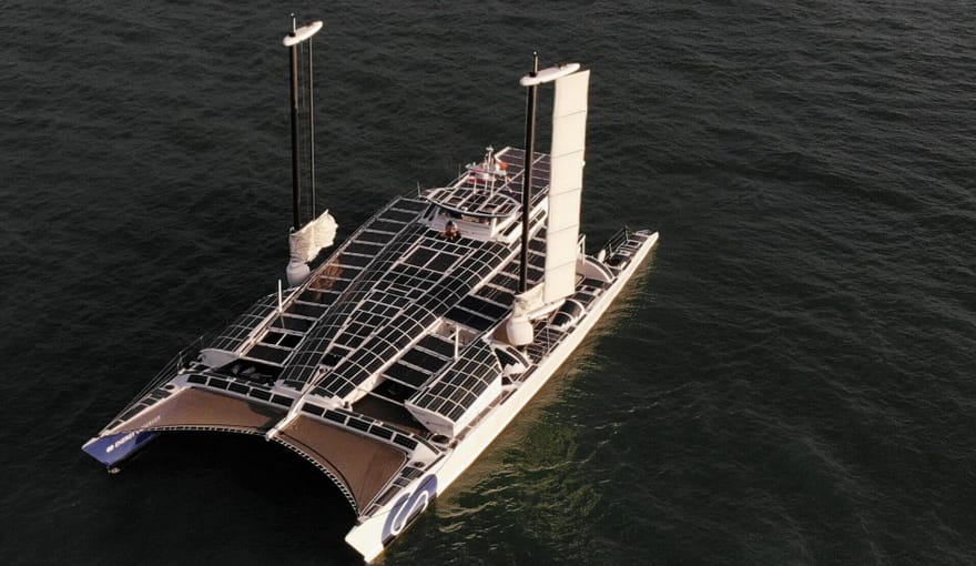 Aerial photo of the Energy Observer, a boat powered by hydrogen and other renewable energy sources,