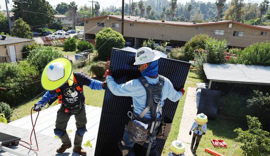 Grid Alternatives employees install rooftop solar in Pomona California