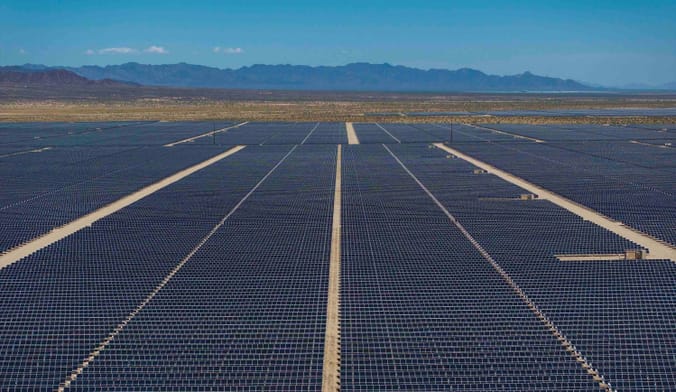 In an aerial view, thousands of solar panels spread across Chuckwalla Valley