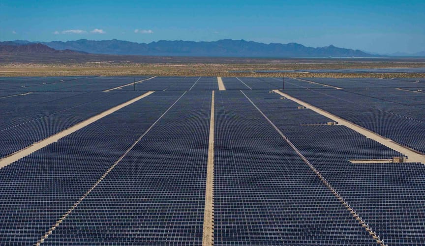 In an aerial view, thousands of solar panels spread across Chuckwalla Valley