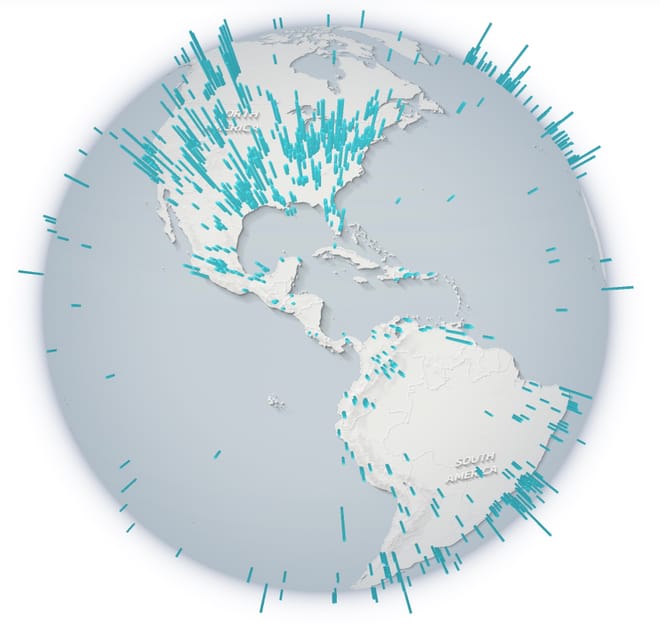 A globe with location pins dropped at many sites