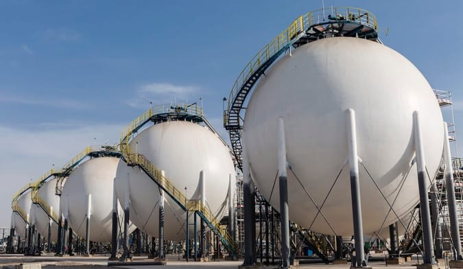 large, white, spherical tanks at an industrial site