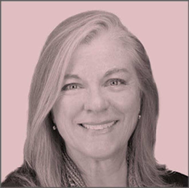 A smiling woman with shoulder length hair in a pink-tinted headshot