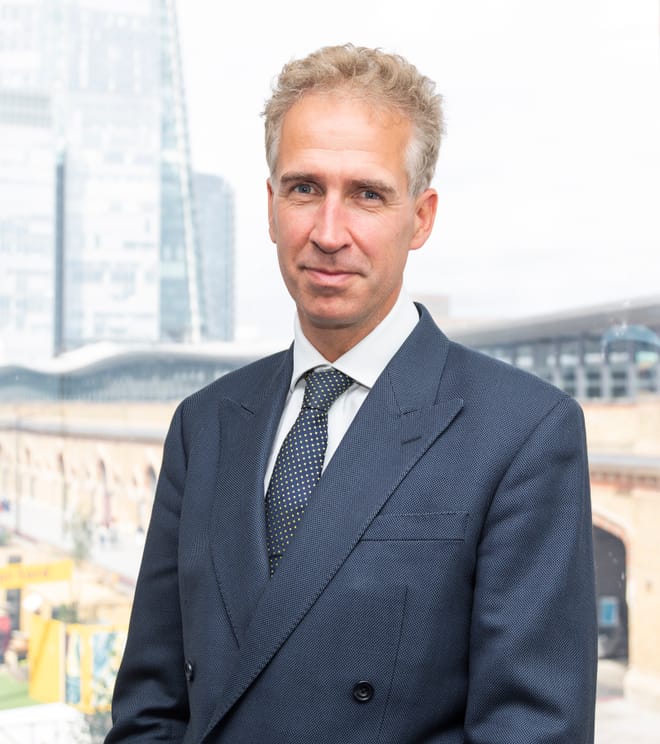 Man in dark suit.