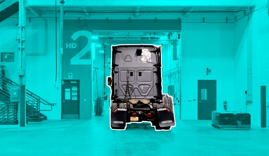 A diesel truck inside a large warehouse.