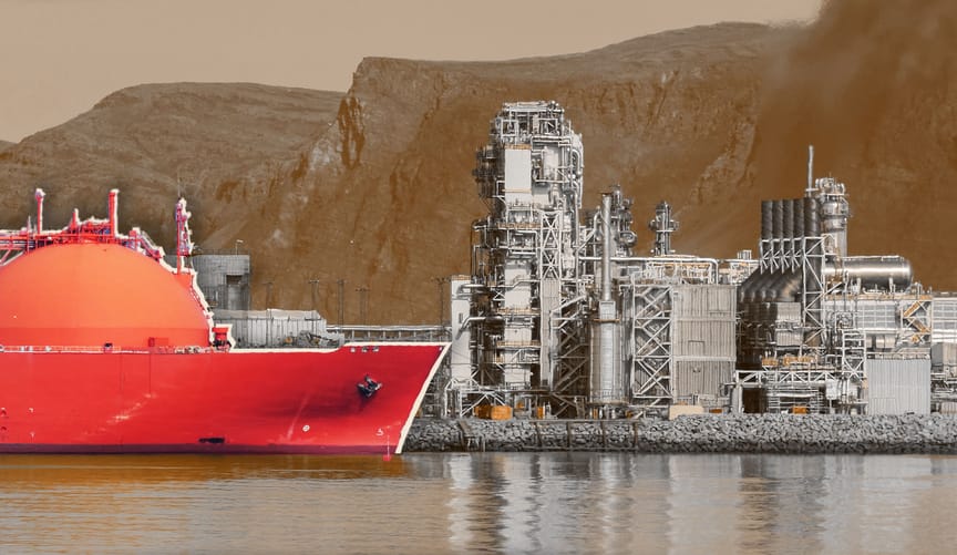 An orange LNG tanker in port near an import terminal against the backdrop of a mountain range
