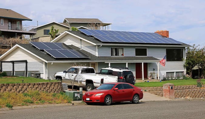 Private residence with rooftop solar panels covering much of the roof.