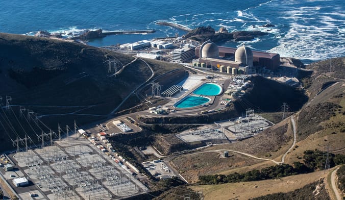 An aerial view of a nuclear power plant near the ocean