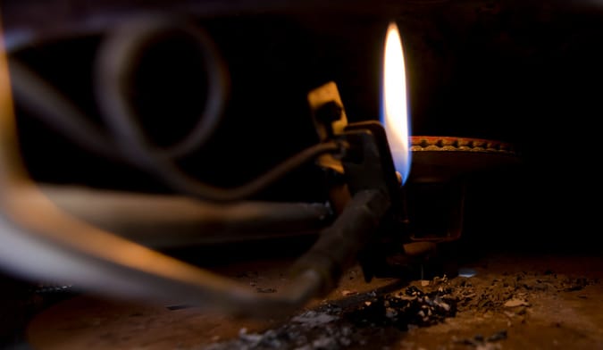 The flame of a gas boiler pilot light