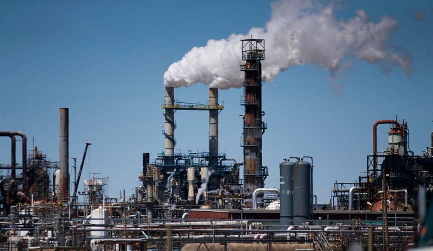 A natural gas fired power plant spewing clouds of steam into the air