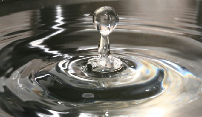 A close-up shot of a drop of water