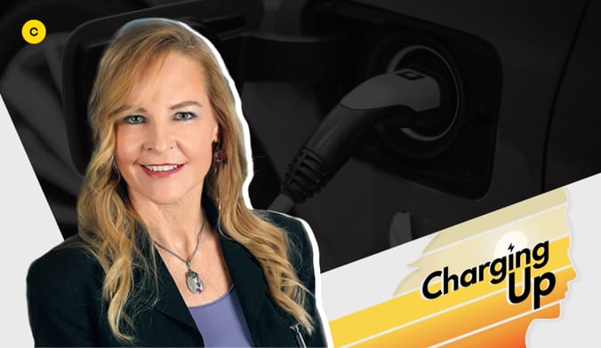 A smiling woman with a light skin tone and long blonde hair. A graphic overlay says CHARGING UP.