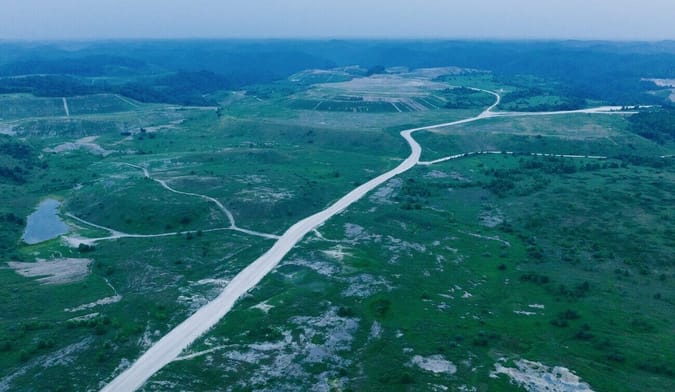 green expanse of reclaimed coal mine