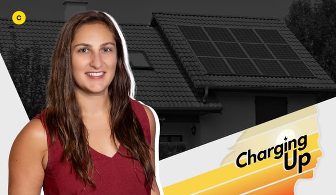 A smiling woman with medium skin tone and long brown hair wearing a sleeveless maroon shirt. Graphic reads "Charging Up."