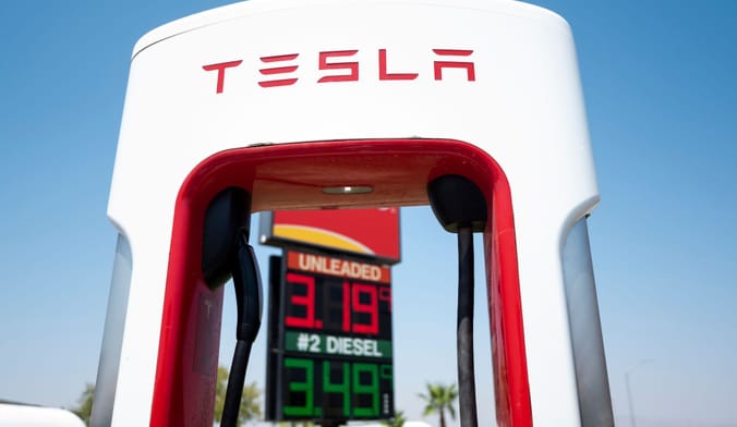 A white and red Tesla EV charger