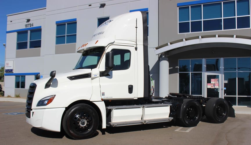 An electric Freightliner e-Cascadia truck owned by Velocity Truck Rental & Leasing