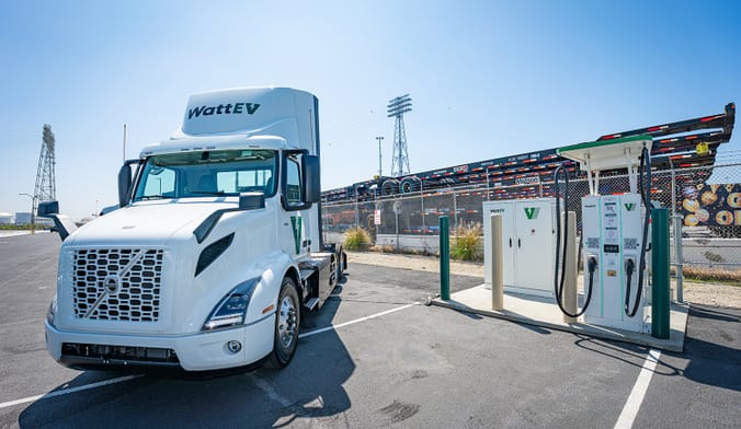Electric truck parked next to charging station at the Port of Long Beach